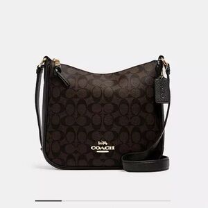 Ellie file black and brown signature leather coach purse. New without pice tags.